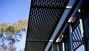 Pritchard likes the shadow patterns on the facade, created by the profiled steel sheet and steel shade structures.